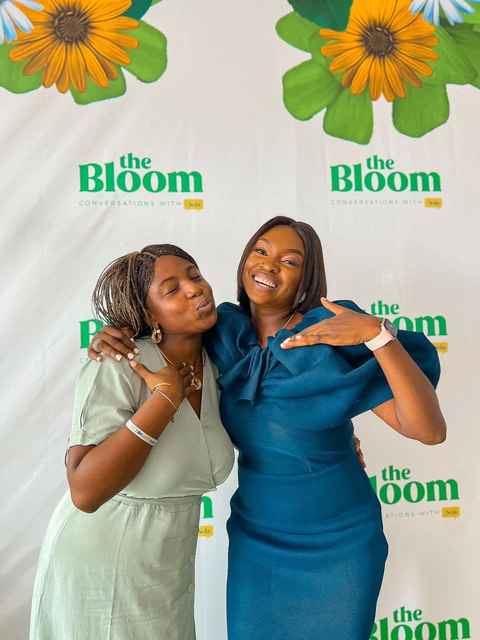 Two women smiling together at a Bloom event